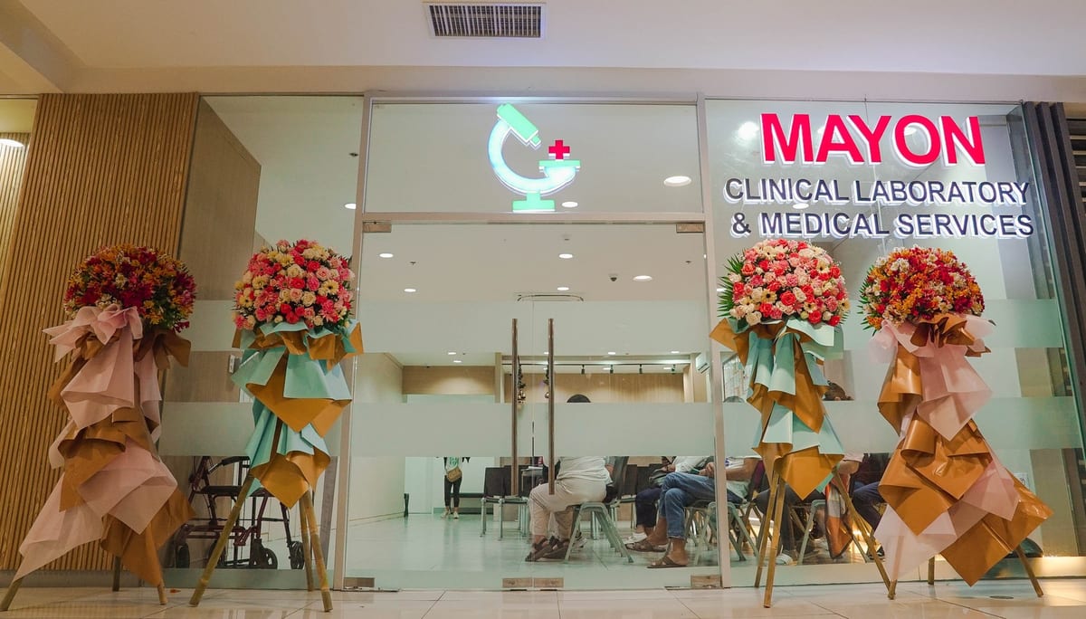 Mayon clinic entrance with reception counter and patient waiting area